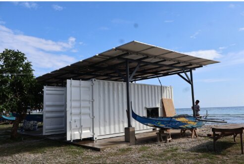 Illustrative PV-battery-electric system canopy showing a larger solar field